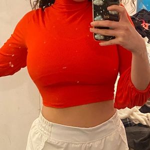 Red cropped turtle neck with baggy sleeves
